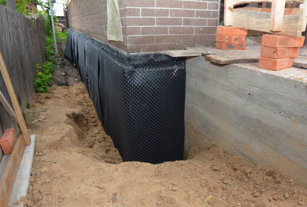 Happy homeowners after waterproofing job in West Chicago